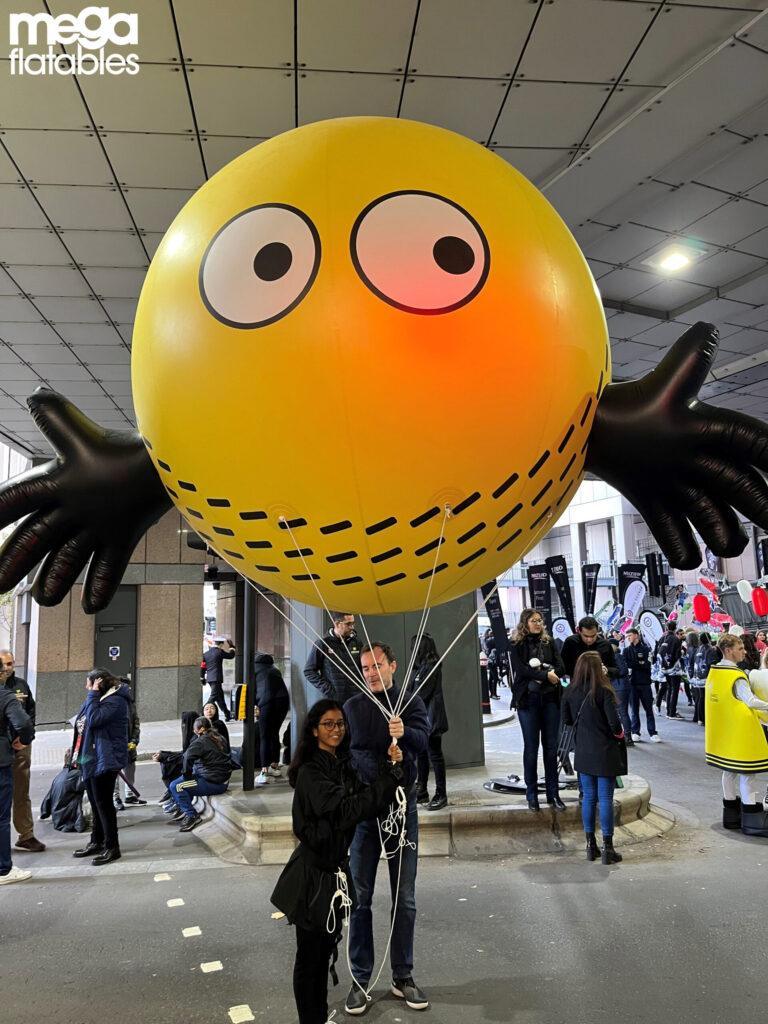 Yellow orb with hands inflatable
