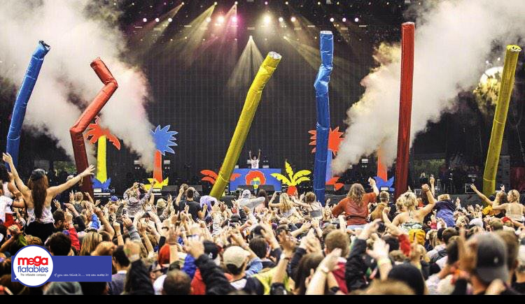 giant inflatable dancers at music festival